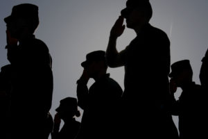 Soldier stand at attention during Pledge of Allegiance
